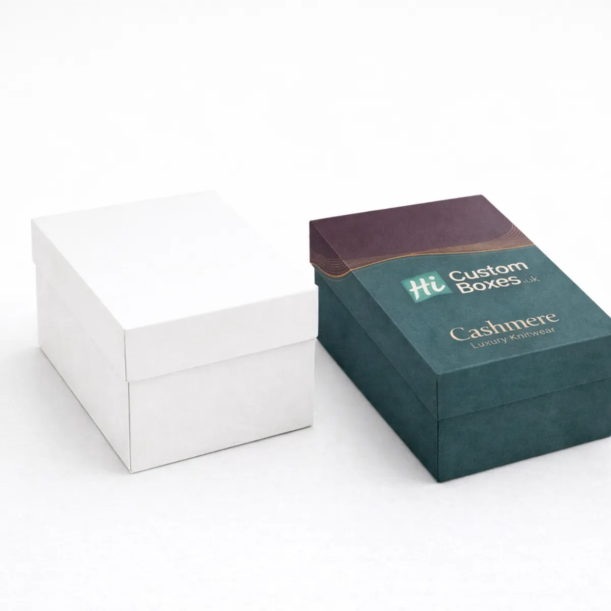 Two sturdy two-piece rigid gift boxes- one plain white and one branded for luxury cashmere knitwear products- class=